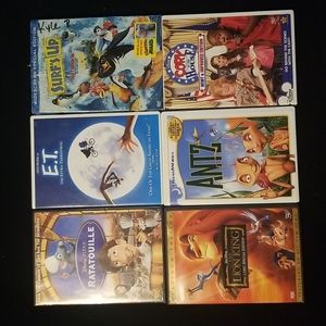 7 used DVD's ET, Surfs Up, Lion king, Ants, Ratatouille and Corey in the House